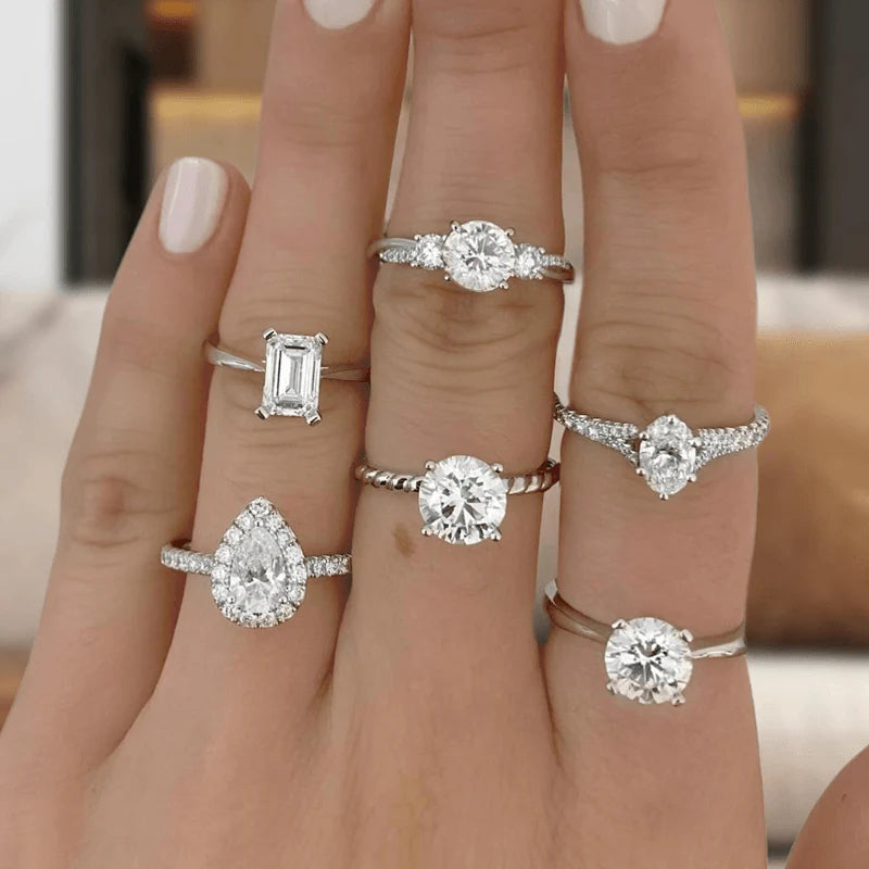 An array of diamond rings compared on a hand